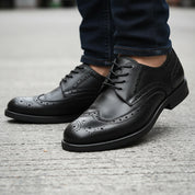 model-walking-street - Men's Black Leather Wingtip Brogues