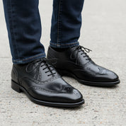 Men's Black Leather Wingtip Oxford Dress Shoes - model-walking-street