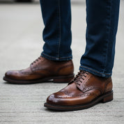 model-walking-street - Men's Black Leather Wingtip Oxfords