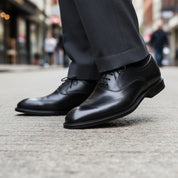 Men's Black Leather Wingtip Oxford Dress Shoes - model-walking-street