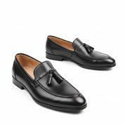 Black Leather Penny Loafers with Tassels - three-quarter-view