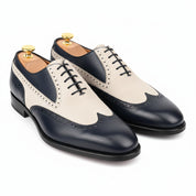 Two-Tone Wingtip Leather Dress Shoes - three-quarter-view